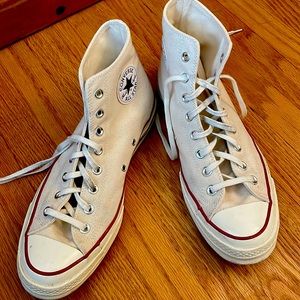 Converse white high top 70s chuck taylors.